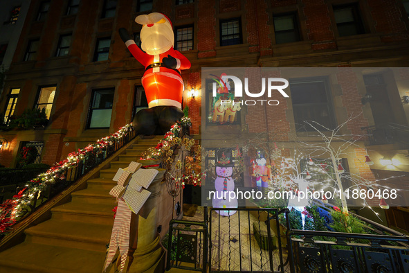 Christmas lights are on display outside a townhouse in the Carnegie Hill section of New York, N.Y., on December 15, 2024. 