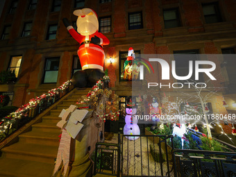 Christmas lights are on display outside a townhouse in the Carnegie Hill section of New York, N.Y., on December 15, 2024. (