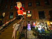 Christmas lights are on display outside a townhouse in the Carnegie Hill section of New York, N.Y., on December 15, 2024. (