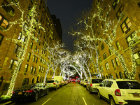 Christmas lights cover trees on a street in the Upper East Side section of New York, N.Y., on December 15, 2024. (