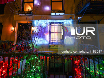 Christmas lights are on display outside a townhouse in the Upper East Side section of New York, N.Y., on December 15, 2024. (