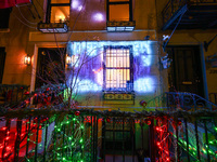 Christmas lights are on display outside a townhouse in the Upper East Side section of New York, N.Y., on December 15, 2024. (