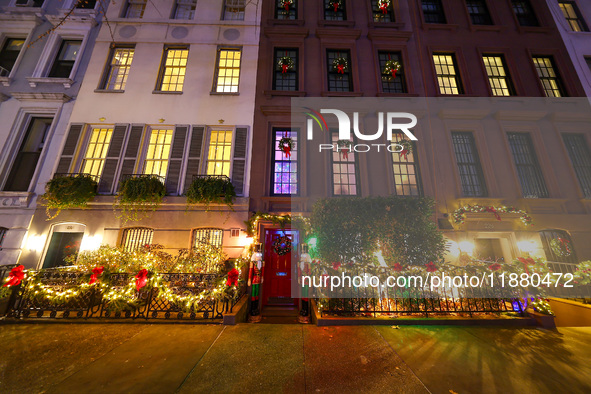 Christmas lights are on display outside a townhouse in the Upper East Side section of New York, N.Y., on December 15, 2024. 