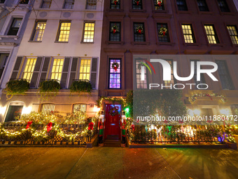 Christmas lights are on display outside a townhouse in the Upper East Side section of New York, N.Y., on December 15, 2024. (