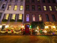 Christmas lights are on display outside a townhouse in the Upper East Side section of New York, N.Y., on December 15, 2024. (