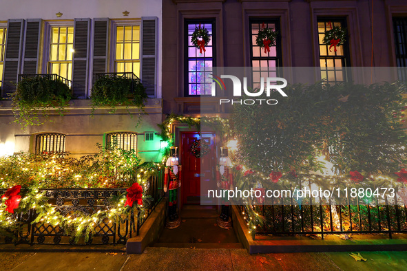 Christmas lights are on display outside a townhouse in the Upper East Side section of New York, N.Y., on December 15, 2024. 