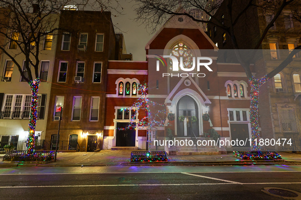 Christmas lights are on display outside a townhouse in the Upper East Side section of New York, N.Y., on December 15, 2024. 