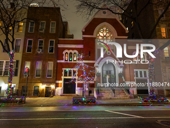 Christmas lights are on display outside a townhouse in the Upper East Side section of New York, N.Y., on December 15, 2024. (