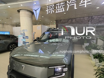 A DEEPAI new energy vehicle is displayed in the hall of NORINCO GROUP in Beijing, China, on December 17, 2024. (