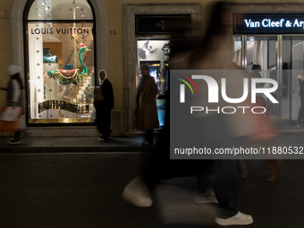 Italian shoppers browse Christmas gifts in central Rome, Italy, on December 18, 2024. Consumer activity in the run-up to Christmas is key to...