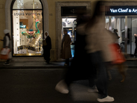 Italian shoppers browse Christmas gifts in central Rome, Italy, on December 18, 2024. Consumer activity in the run-up to Christmas is key to...