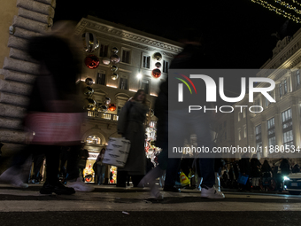 Italian shoppers browse Christmas gifts in central Rome, Italy, on December 18, 2024. Consumer activity in the run-up to Christmas is key to...