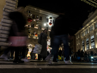 Italian shoppers browse Christmas gifts in central Rome, Italy, on December 18, 2024. Consumer activity in the run-up to Christmas is key to...