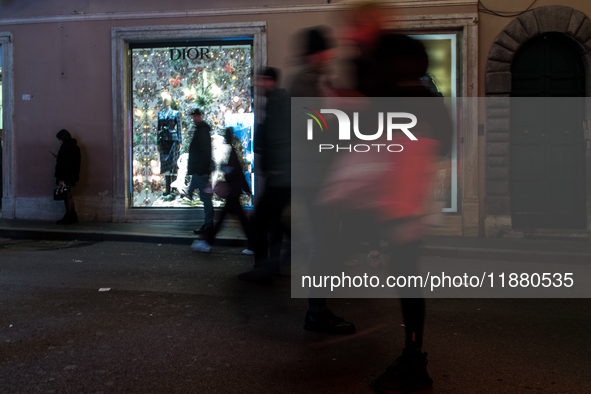 Italian shoppers browse Christmas gifts in central Rome, Italy, on December 18, 2024. Consumer activity in the run-up to Christmas is key to...