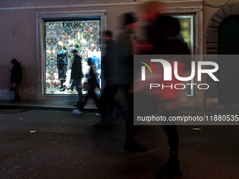 Italian shoppers browse Christmas gifts in central Rome, Italy, on December 18, 2024. Consumer activity in the run-up to Christmas is key to...