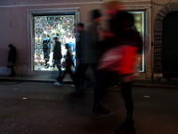 Italian shoppers browse Christmas gifts in central Rome, Italy, on December 18, 2024. Consumer activity in the run-up to Christmas is key to...