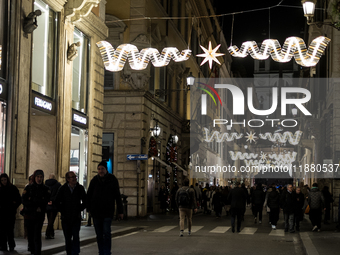 Italian shoppers browse Christmas gifts in central Rome, Italy, on December 18, 2024. Consumer activity in the run-up to Christmas is key to...