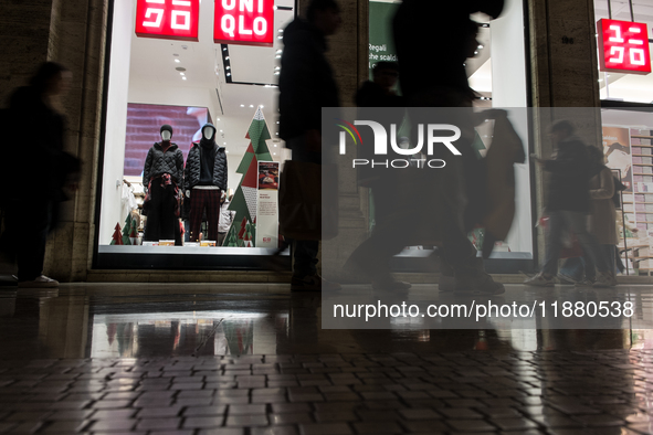 Italian shoppers browse Christmas gifts in central Rome, Italy, on December 18, 2024. Consumer activity in the run-up to Christmas is key to...