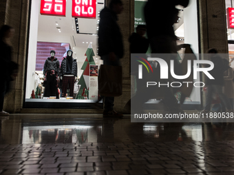 Italian shoppers browse Christmas gifts in central Rome, Italy, on December 18, 2024. Consumer activity in the run-up to Christmas is key to...