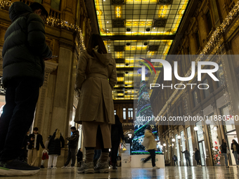 Italian shoppers browse Christmas gifts in central Rome, Italy, on December 18, 2024. Consumer activity in the run-up to Christmas is key to...