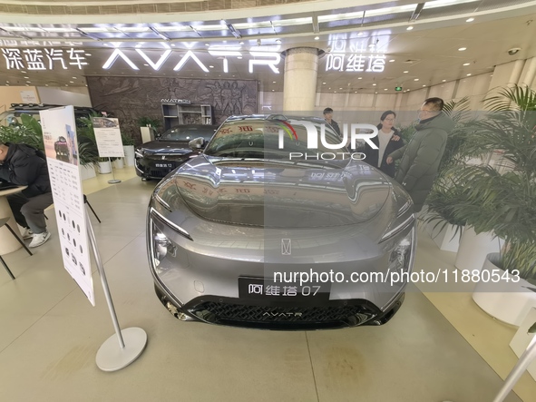 An AVATR new energy vehicle is displayed in the hall of NORINCO GROUP in Beijing, China, on December 17, 2024. 