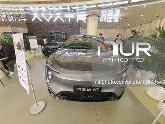 An AVATR new energy vehicle is displayed in the hall of NORINCO GROUP in Beijing, China, on December 17, 2024. (