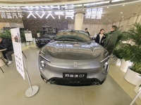 An AVATR new energy vehicle is displayed in the hall of NORINCO GROUP in Beijing, China, on December 17, 2024. (