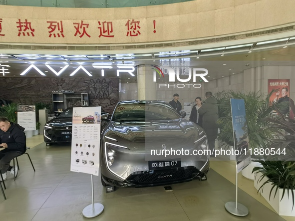 An AVATR new energy vehicle is displayed in the hall of NORINCO GROUP in Beijing, China, on December 17, 2024. 