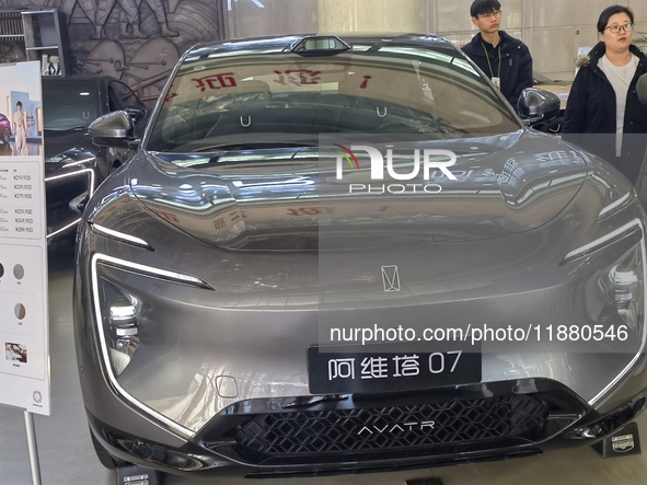 An AVATR new energy vehicle is displayed in the hall of NORINCO GROUP in Beijing, China, on December 17, 2024. 