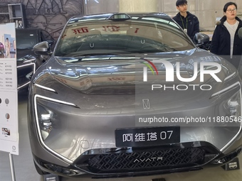 An AVATR new energy vehicle is displayed in the hall of NORINCO GROUP in Beijing, China, on December 17, 2024. (