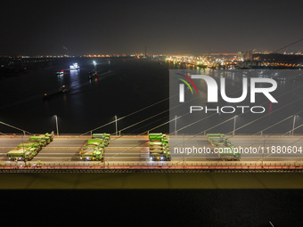 Vehicles perform a static load test on the Baguazhou Yangtze River Bridge in Nanjing, China, on December 18, 2024. (