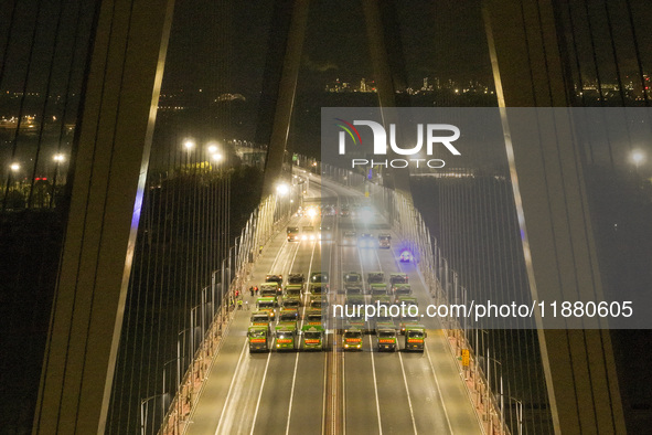 Vehicles perform a static load test on the Baguazhou Yangtze River Bridge in Nanjing, China, on December 18, 2024. 