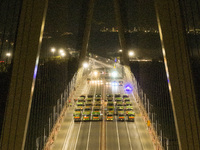 Vehicles perform a static load test on the Baguazhou Yangtze River Bridge in Nanjing, China, on December 18, 2024. (