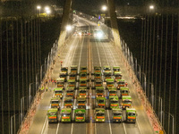 Vehicles perform a static load test on the Baguazhou Yangtze River Bridge in Nanjing, China, on December 18, 2024. (