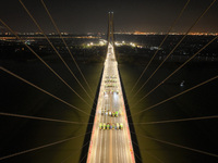 Vehicles perform a static load test on the Baguazhou Yangtze River Bridge in Nanjing, China, on December 18, 2024. (