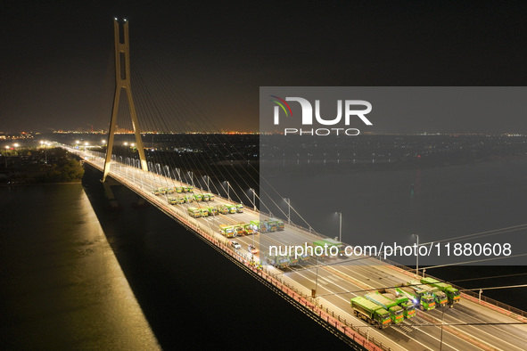 Vehicles perform a static load test on the Baguazhou Yangtze River Bridge in Nanjing, China, on December 18, 2024. 