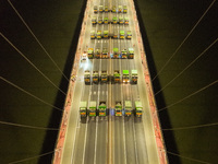 Vehicles perform a static load test on the Baguazhou Yangtze River Bridge in Nanjing, China, on December 18, 2024. (