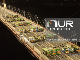 Vehicles perform a static load test on the Baguazhou Yangtze River Bridge in Nanjing, China, on December 18, 2024. (