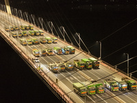 Vehicles perform a static load test on the Baguazhou Yangtze River Bridge in Nanjing, China, on December 18, 2024. (