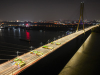 Vehicles perform a static load test on the Baguazhou Yangtze River Bridge in Nanjing, China, on December 18, 2024. (