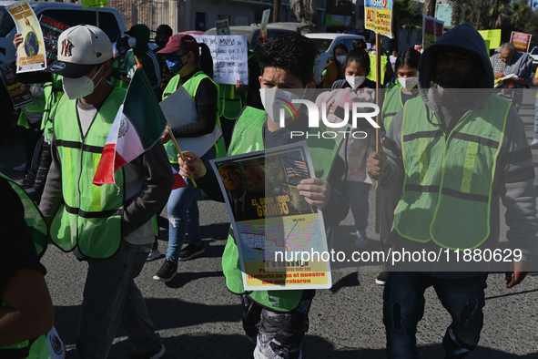 Mexican migrants who have been deported from the United States to Mexico, families seeking asylum, and activists demonstrate for migrants' r...