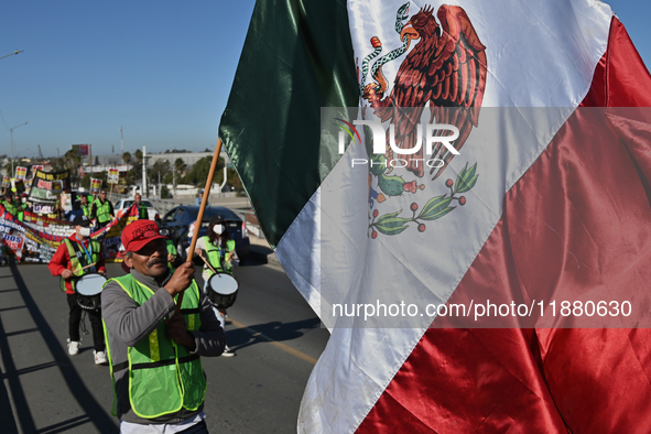 Mexican migrants who have been deported from the United States to Mexico, families seeking asylum, and activists demonstrate for migrants' r...