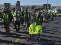 Mexican migrants who have been deported from the United States to Mexico, families seeking asylum, and activists demonstrate for migrants' r...