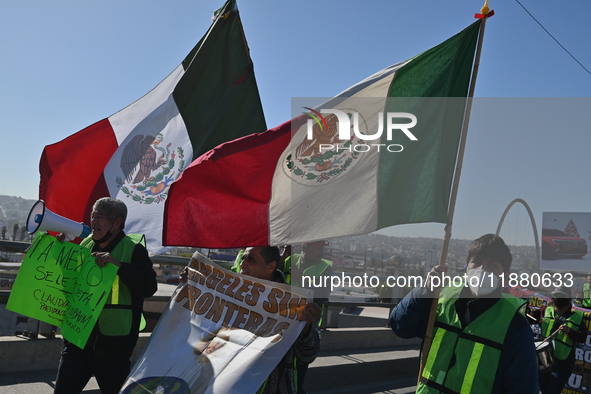 Mexican migrants who have been deported from the United States to Mexico, families seeking asylum, and activists demonstrate for migrants' r...