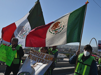 Mexican migrants who have been deported from the United States to Mexico, families seeking asylum, and activists demonstrate for migrants' r...