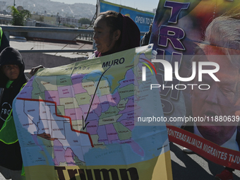 Mexican migrants who have been deported from the United States to Mexico, families seeking asylum, and activists demonstrate for migrants' r...