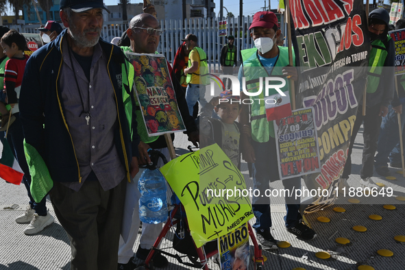 Mexican migrants who have been deported from the United States to Mexico, families seeking asylum, and activists demonstrate for migrants' r...