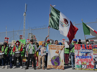 Mexican migrants who have been deported from the United States to Mexico, families seeking asylum, and activists demonstrate for migrants' r...