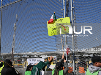 Mexican migrants who have been deported from the United States to Mexico, families seeking asylum, and activists demonstrate for migrants' r...