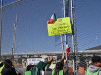 Mexican migrants who have been deported from the United States to Mexico, families seeking asylum, and activists demonstrate for migrants' r...